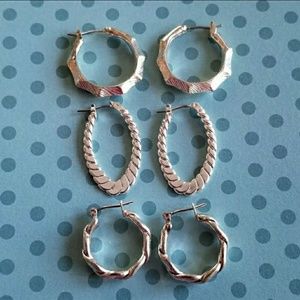 Three pairs silver tone hoop earrings